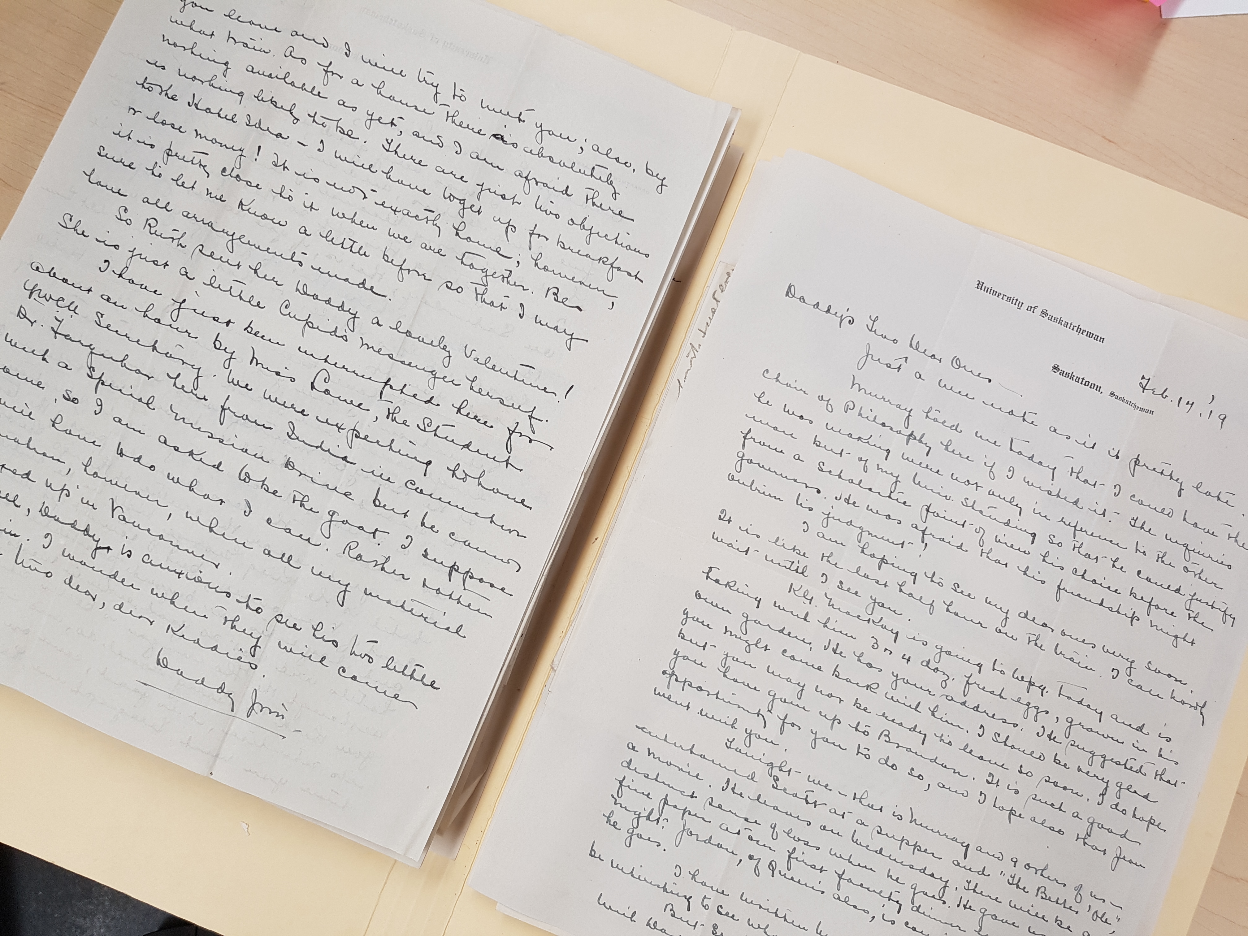 Photograph of handwritten documents inside a manila folder. 