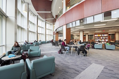 Students studying on the ground floor of the Leslie and Irene Dube Health Science Library.